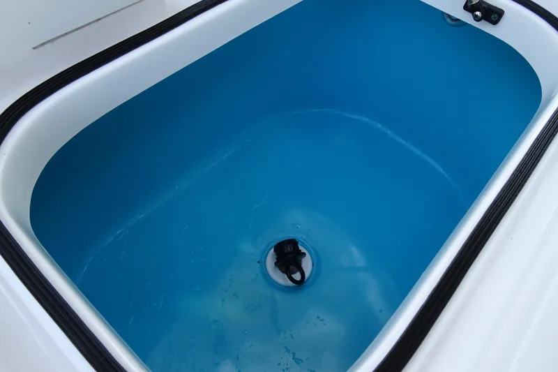 Slide: The Image of Blue interior of a Vtech 18 model 2023 container with a drain plug. - 26