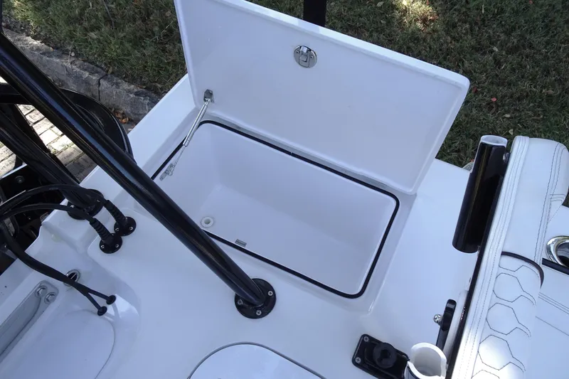Slide: The Image of Open storage compartment on a 2023 Vtech model 18 boat, featuring sleek design and functionality. - 27