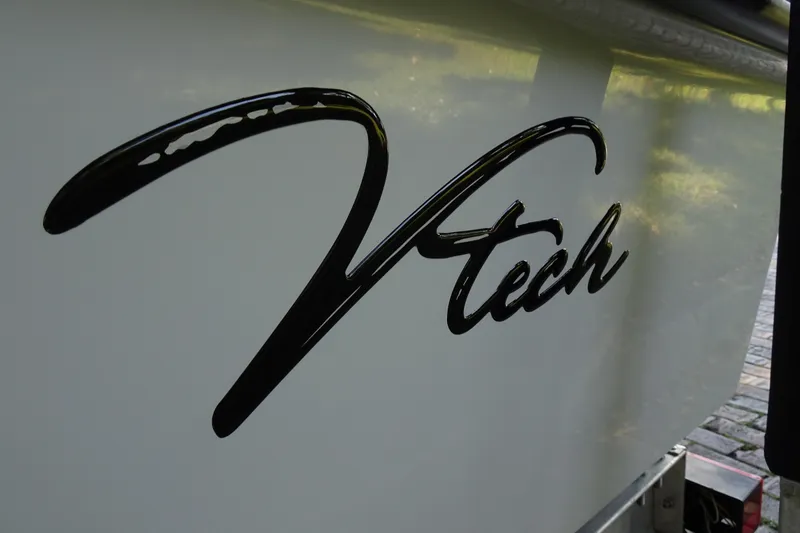 Slide: The Image of Vtech 18 logo on sleek surface, 2023 model design. - 29