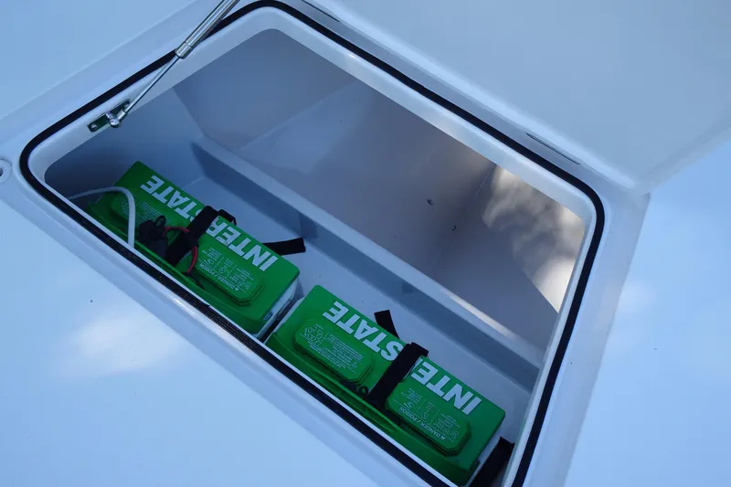 Slide: The Image of Open compartment with two green Interstate batteries in a Vtech 18, 2023 model. - 30