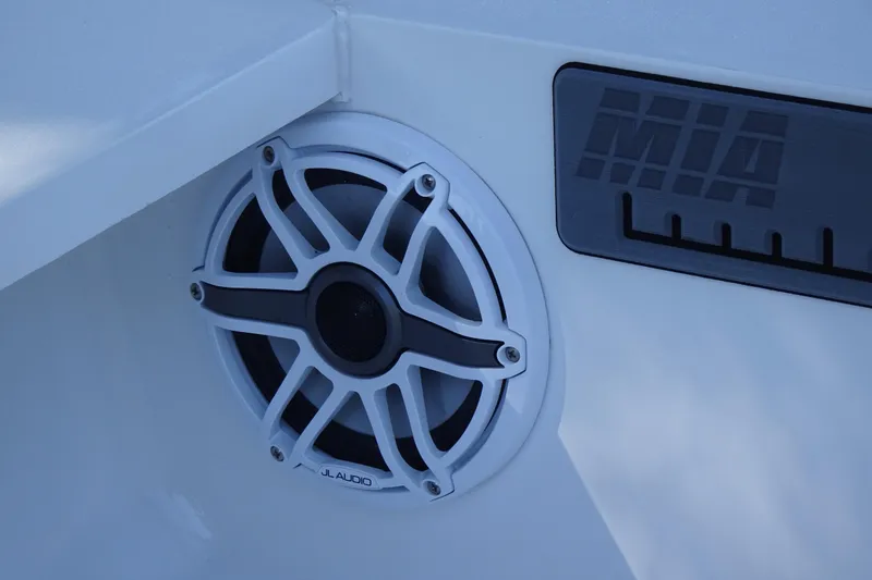Slide: The Image of White JL Audio speaker on Vtech 18, 2023 model boat interior. - 31