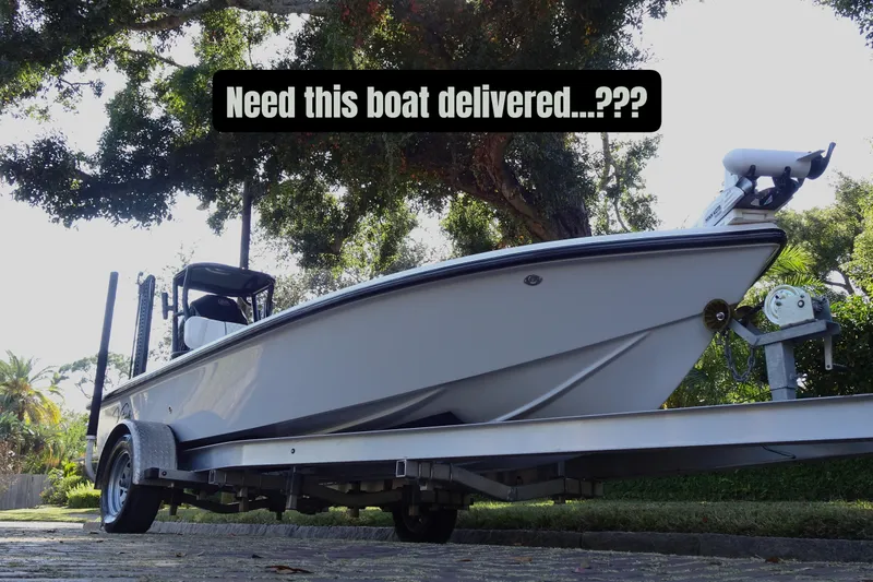 Slide: The Image of White Vtech 18 boat on trailer under trees, 2023 model, delivery inquiry text. - 4