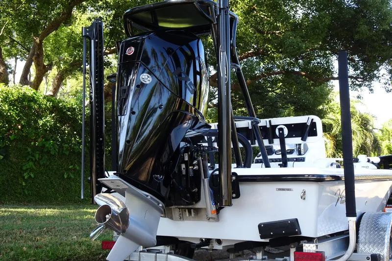 Slide: The Image of Vtech 18 boat, 2023 model, with powerful outboard motor, parked outdoors. - 7