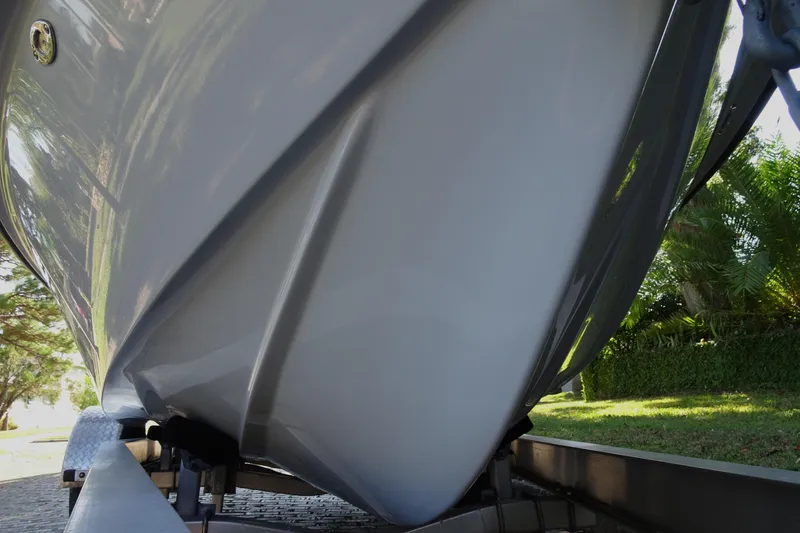 Slide: The Image of Close-up of a 2023 Vtech 18 boat hull on a trailer. - 8