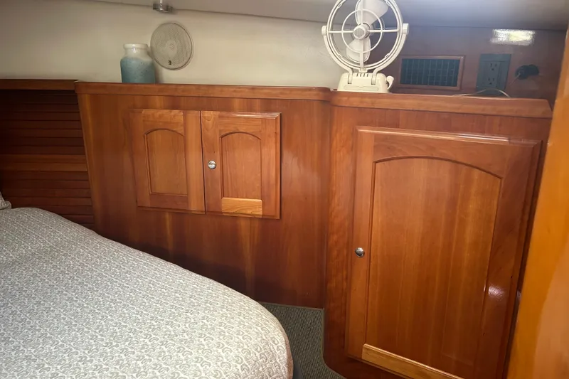 Slide: The Image of Interior of a 2007 Legacy Yachts Express with wooden cabinetry. - 16