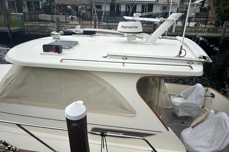 Slide: The Image of Legacy Yachts Express 2007 at a dock, side view. - 9