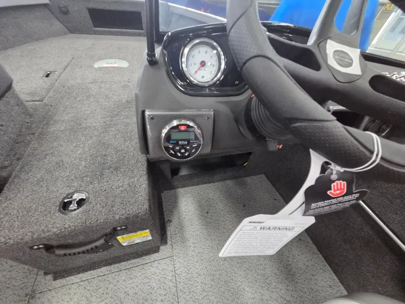 Slide: The Image of Interior of Crestliner 1750 HAWKWT JS 2026 with steering wheel and dashboard. - 15