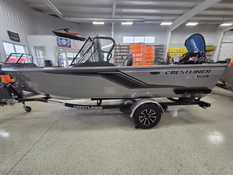 Slide: The Image of 2026 Crestliner 1750 HAWKWT JS boat in showroom. - 5