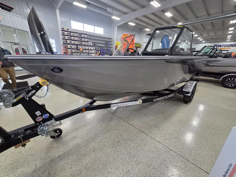 Slide: The Image of 2026 Crestliner 1750 HAWKWT JS boat in showroom. - 6