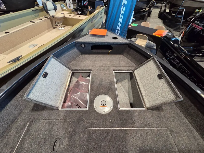 Slide: The Image of Crestliner 1850 Kodiak SC 2026 with open storage hatch. - 7