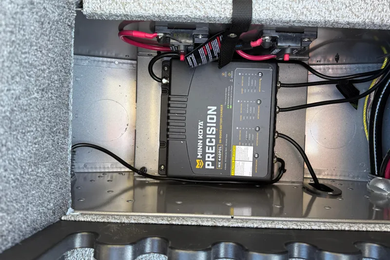 Slide: The Image of 2026 Lund 1875 Pro Guide boat with Minn Kota Precision battery charger installed. - 13