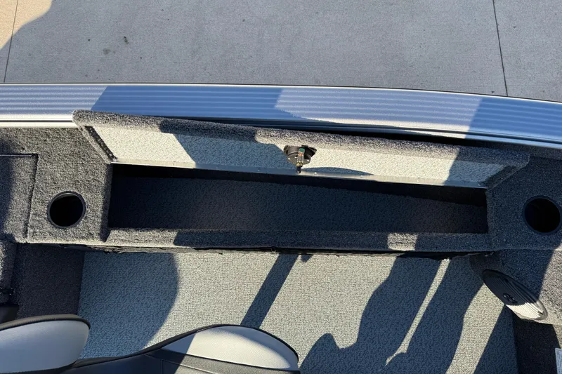 Slide: The Image of Lund 1875 Pro Guide 2026 boat, open storage compartment. - 17