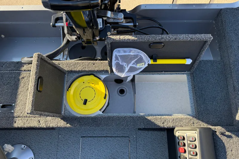 Slide: The Image of 2026 Lund 1875 Pro Guide boat interior with storage compartments and fishing gear. - 21