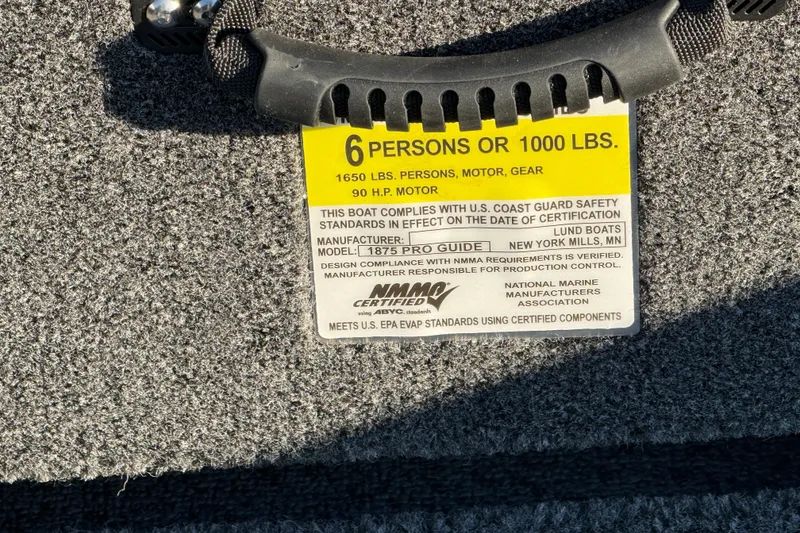 Slide: The Image of Safety label on 2026 Lund 1875 Pro Guide boat, capacity 6 persons or 1000 lbs. - 24
