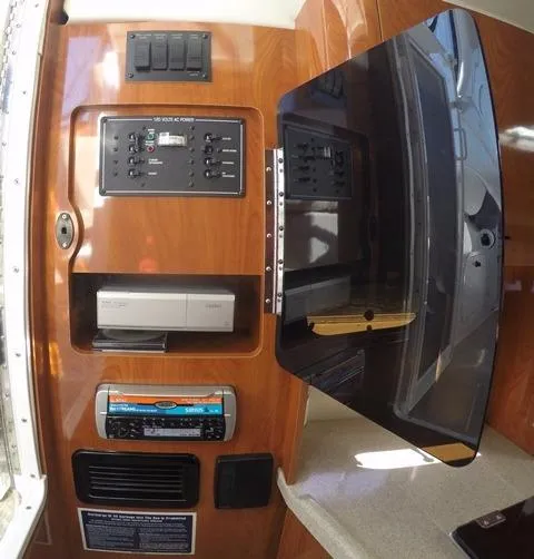 Slide: The Image of 2005 Four Winns 268 Vista boat interior with control panel and stereo system. - 26