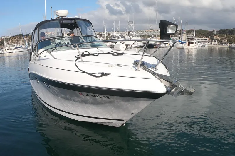 Slide: The Image of 2005 Four Winns 268 Vista boat docked in a marina with clear skies. - 3