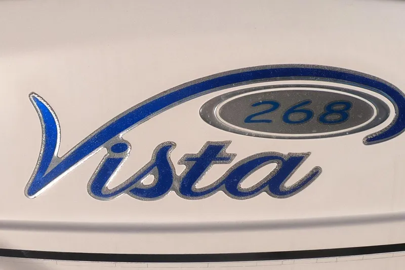 Slide: The Image of 2005 Four Winns 268 Vista logo with blue and silver design. - 34
