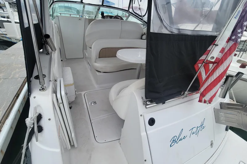 Slide: The Image of 2005 Four Winns 268 Vista boat interior with seating and American flag. - 4