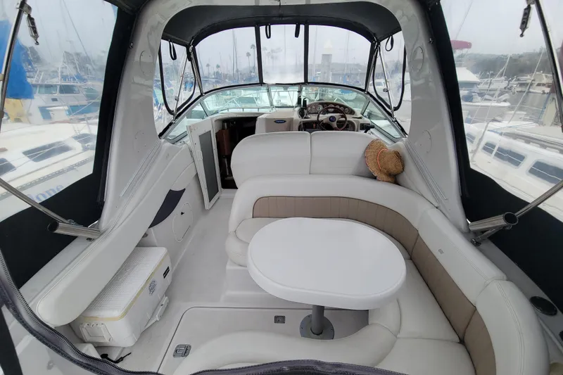 Slide: The Image of Interior of 2005 Four Winns 268 Vista boat with seating and table. - 7
