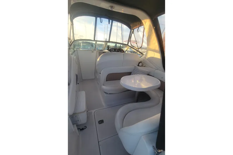 Slide: The Image of Interior of 2005 Four Winns 268 Vista boat with seating and table. - 8