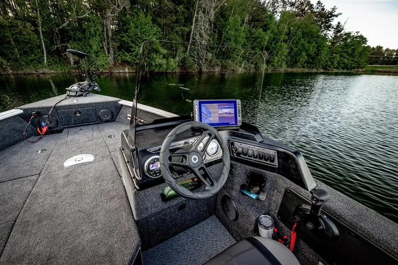 Slide: The Image of 2026 Lund 1775 Impact XS SS boat with Mercury engine on trailer. - 7