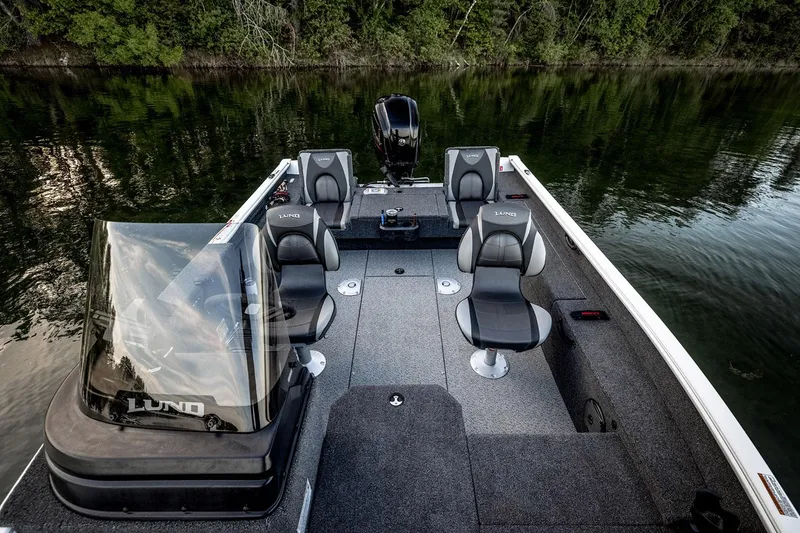 Slide: The Image of 2026 Lund 1775 Impact XS SS boat interior with seating and speakers. - 9