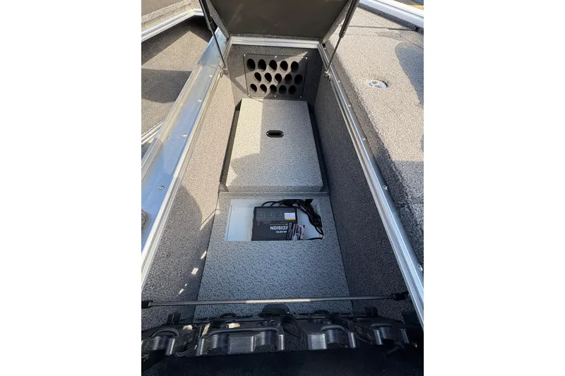 Slide: The Image of 2026 Lund 1875 Pro-V Bass XS boat interior storage compartment with organized layout. - 10