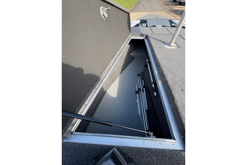 Slide: The Image of Open storage compartment in 2026 Lund 1875 Pro-V Bass XS boat. - 12
