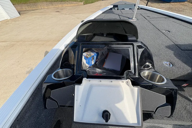 Slide: The Image of 2026 Lund 1875 Pro-V Bass XS boat with open storage compartment and cup holders. - 20