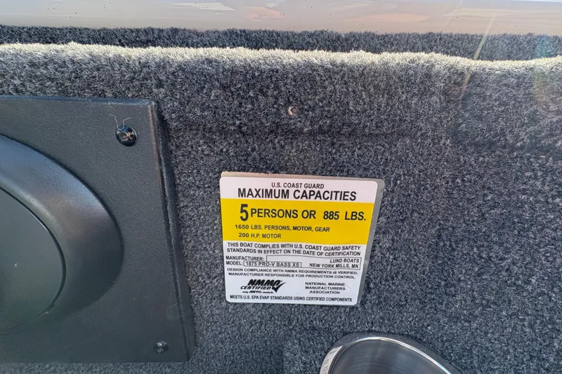 Slide: The Image of 2026 Lund 1875 Pro-V Bass XS capacity label, 5 persons or 885 lbs limit. - 23