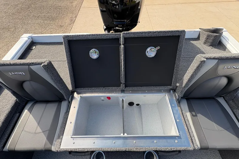 Slide: The Image of 2026 Lund 1875 Pro-V Bass XS boat interior with open storage compartment and seating. - 27