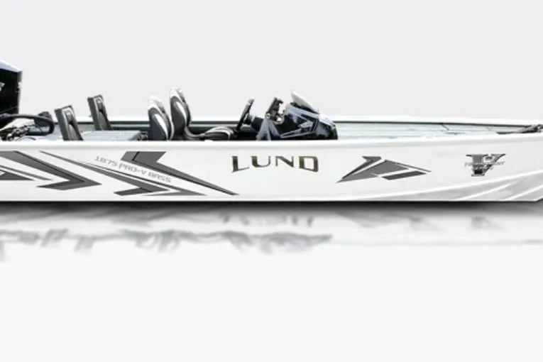 Slide: The Image of 2026 Lund 1875 Pro-V Bass XS boat, sleek design, side view, white with graphics. - 33