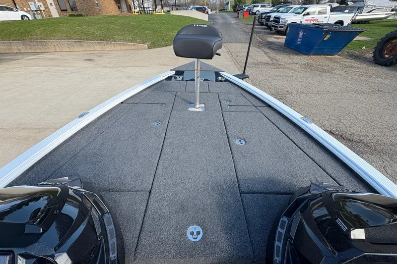 Slide: The Image of 2026 Lund 1875 Pro-V Bass XS boat deck with seating and storage compartments. - 9