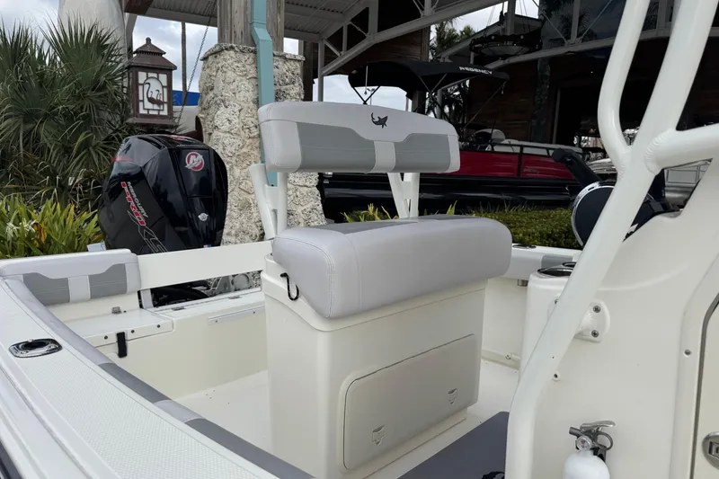 Slide: The Image of 2024 Mako 214 Center Console boat interior with seating and engine view. - 6