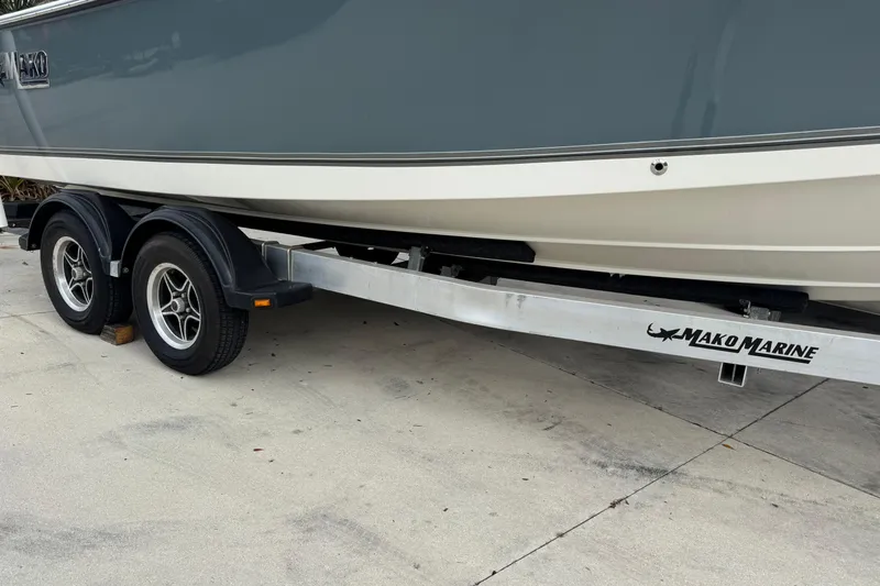Slide: The Image of 2024 Mako 214 Center Console boat on a Mako Marine trailer. - 7