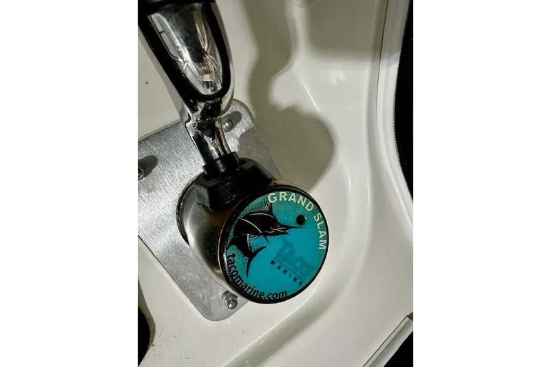 Slide: The Image of Close-up of a 2016 Boston Whaler 285 Conquest boat control lever with Grand Slam logo. - 22