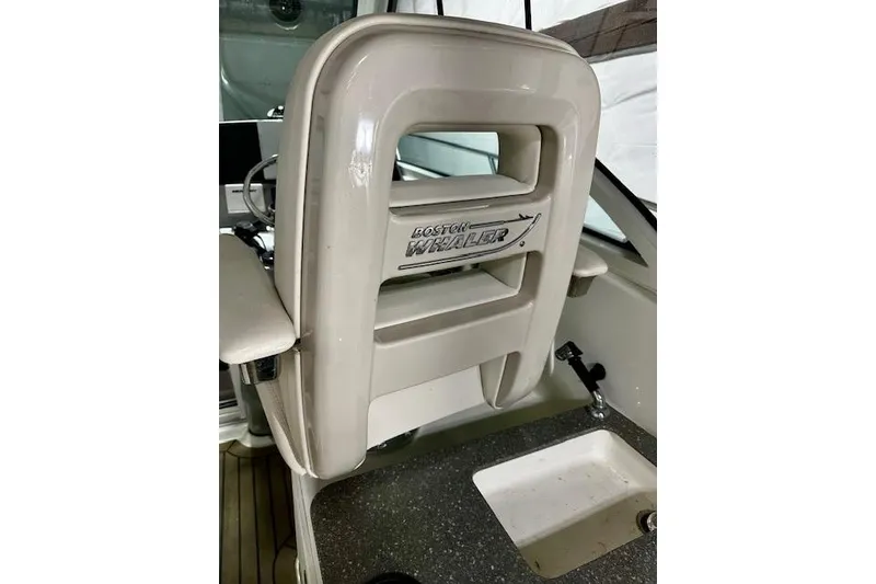 Slide: The Image of 2016 Boston Whaler 285 Conquest boat seat with logo, interior view. - 30