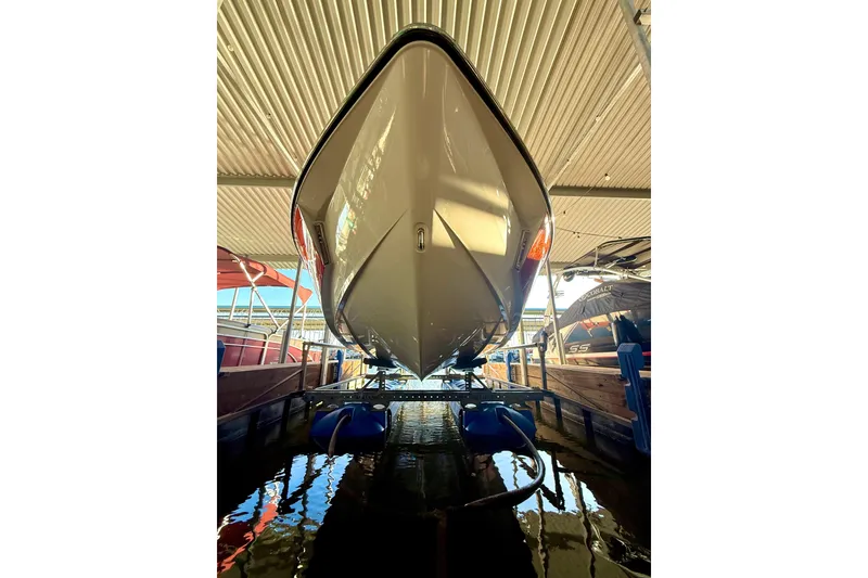 Slide: The Image of 2019 Malibu Wakesetter 23 LSV boat docked in a covered marina. - 15