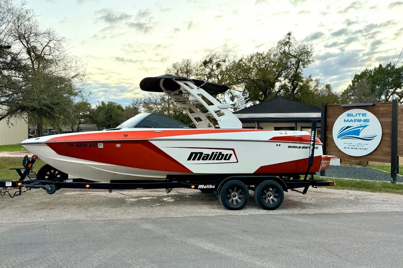 Slide: The Image of 2019 Malibu Wakesetter 23 LSV boat on trailer at Elite Marine dealership. - 16