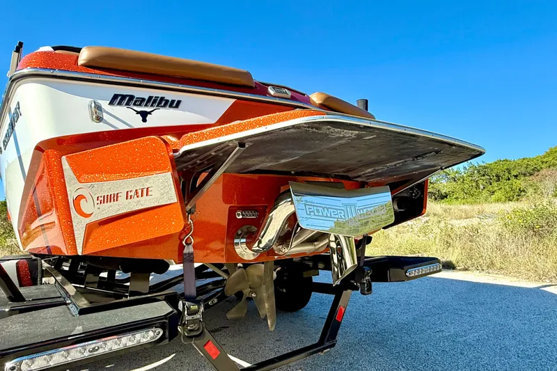 Slide: The Image of 2019 Malibu Wakesetter 23 LSV boat with Surf Gate feature, rear view. - 22
