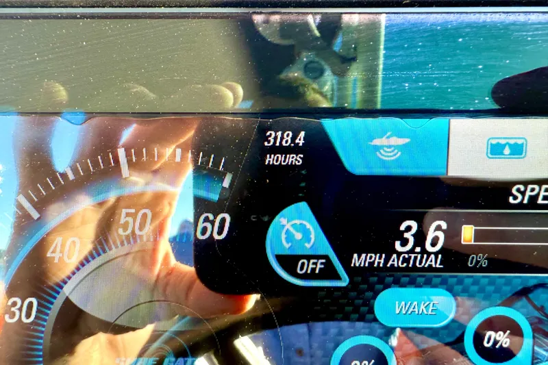 Slide: The Image of Dashboard of 2019 Malibu Wakesetter 23 LSV showing 318.4 hours and 3.6 MPH speed. - 30