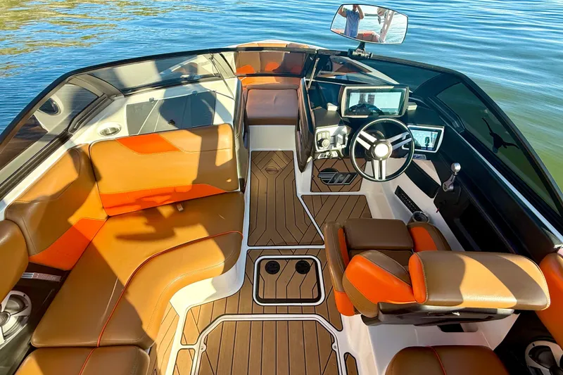 Slide: The Image of 2019 Malibu Wakesetter 23 LSV interior with brown leather seats and modern dashboard. - 37
