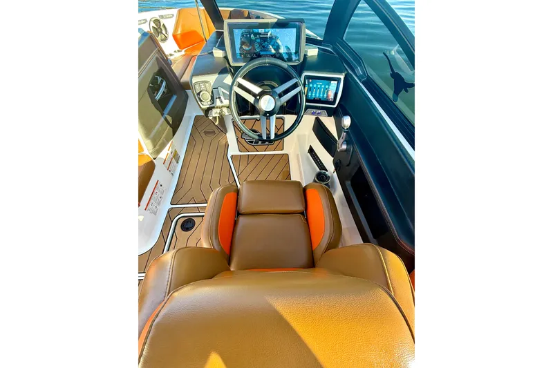 Slide: The Image of 2019 Malibu Wakesetter 23 LSV cockpit with modern controls and luxurious seating. - 38