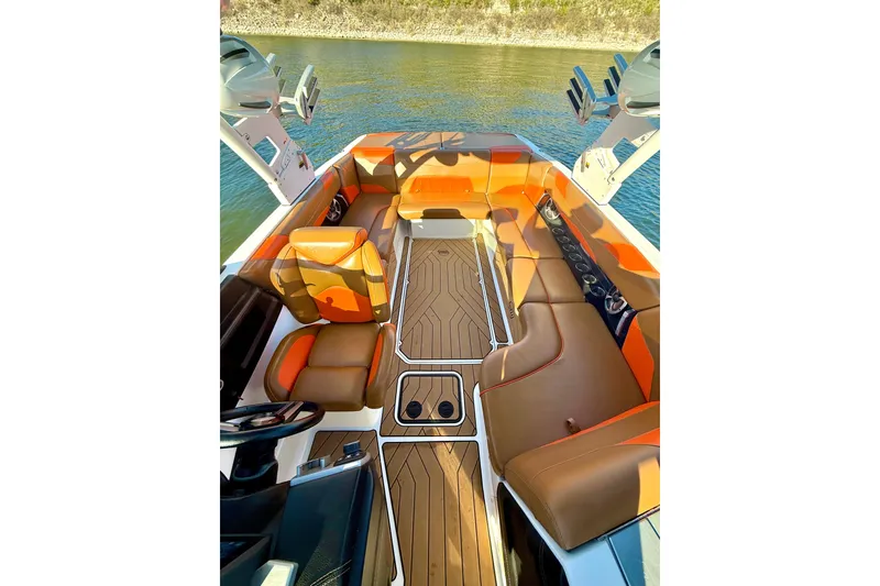 Slide: The Image of 2019 Malibu Wakesetter 23 LSV interior with orange and brown seating on water. - 49