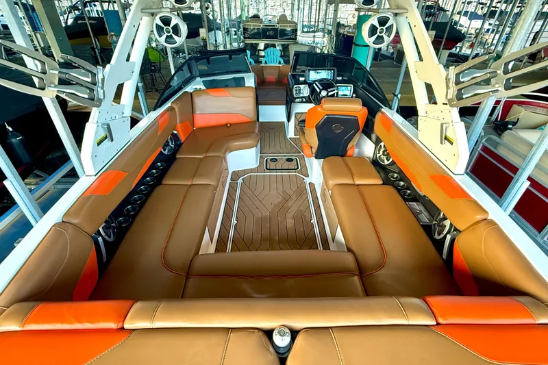 Slide: The Image of 2019 Malibu Wakesetter 23 LSV interior with orange and brown seating, advanced dashboard. - 56