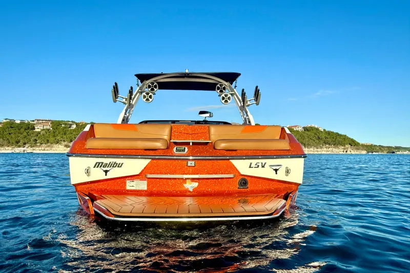 Slide: The Image of 2019 Malibu Wakesetter 23 LSV on water, showcasing sleek design and vibrant colors. - 9