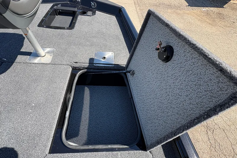 Slide: The Image of Open storage compartment on 2026 Lund 1875 Renegade boat deck. - 12