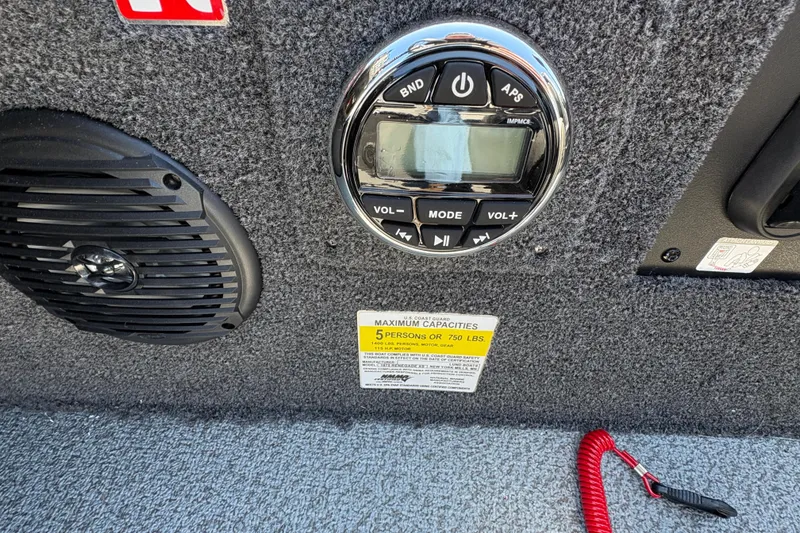 Slide: The Image of Control panel and speaker on 2026 Lund 1875 Renegade boat interior. - 17