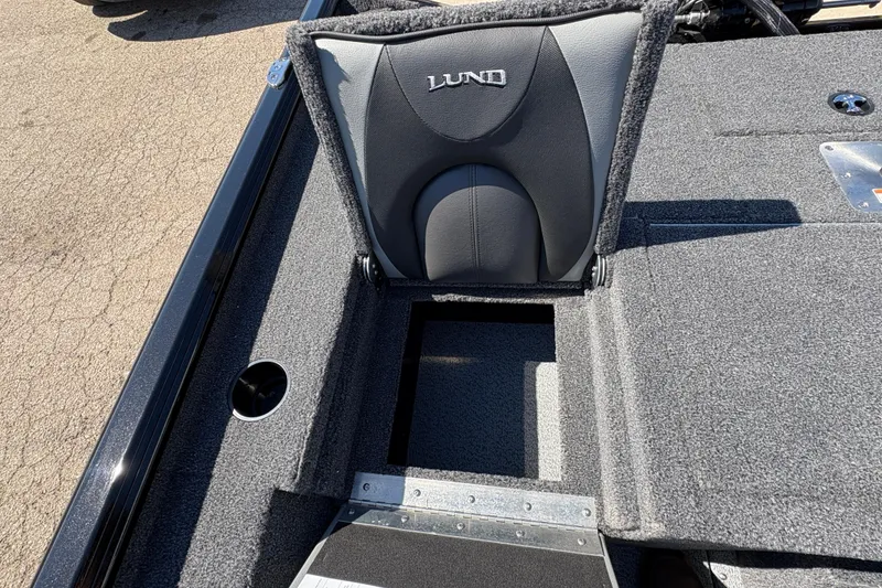 Slide: The Image of 2026 Lund 1875 Renegade boat seat with storage compartment, gray upholstery. - 22