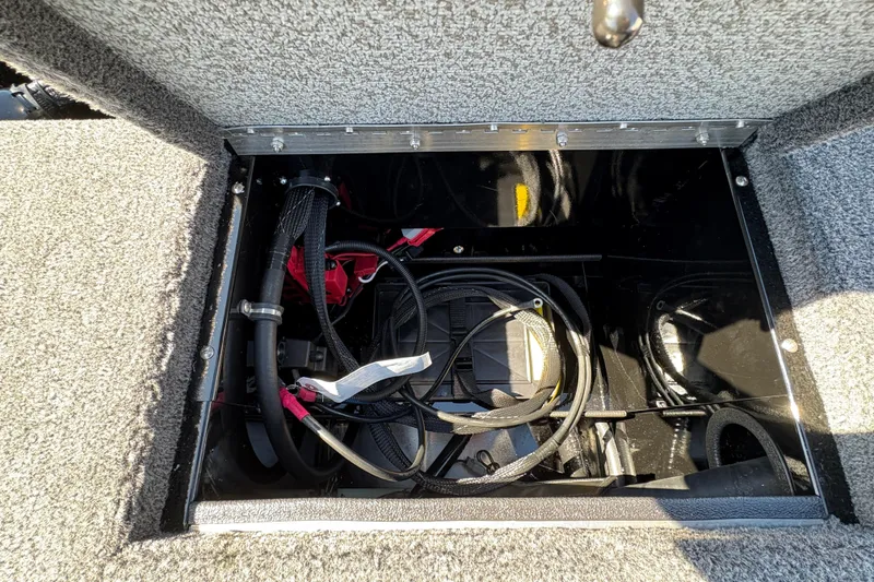 Slide: The Image of Storage compartment of 2026 Lund 1875 Renegade boat, featuring cables and wiring. - 24